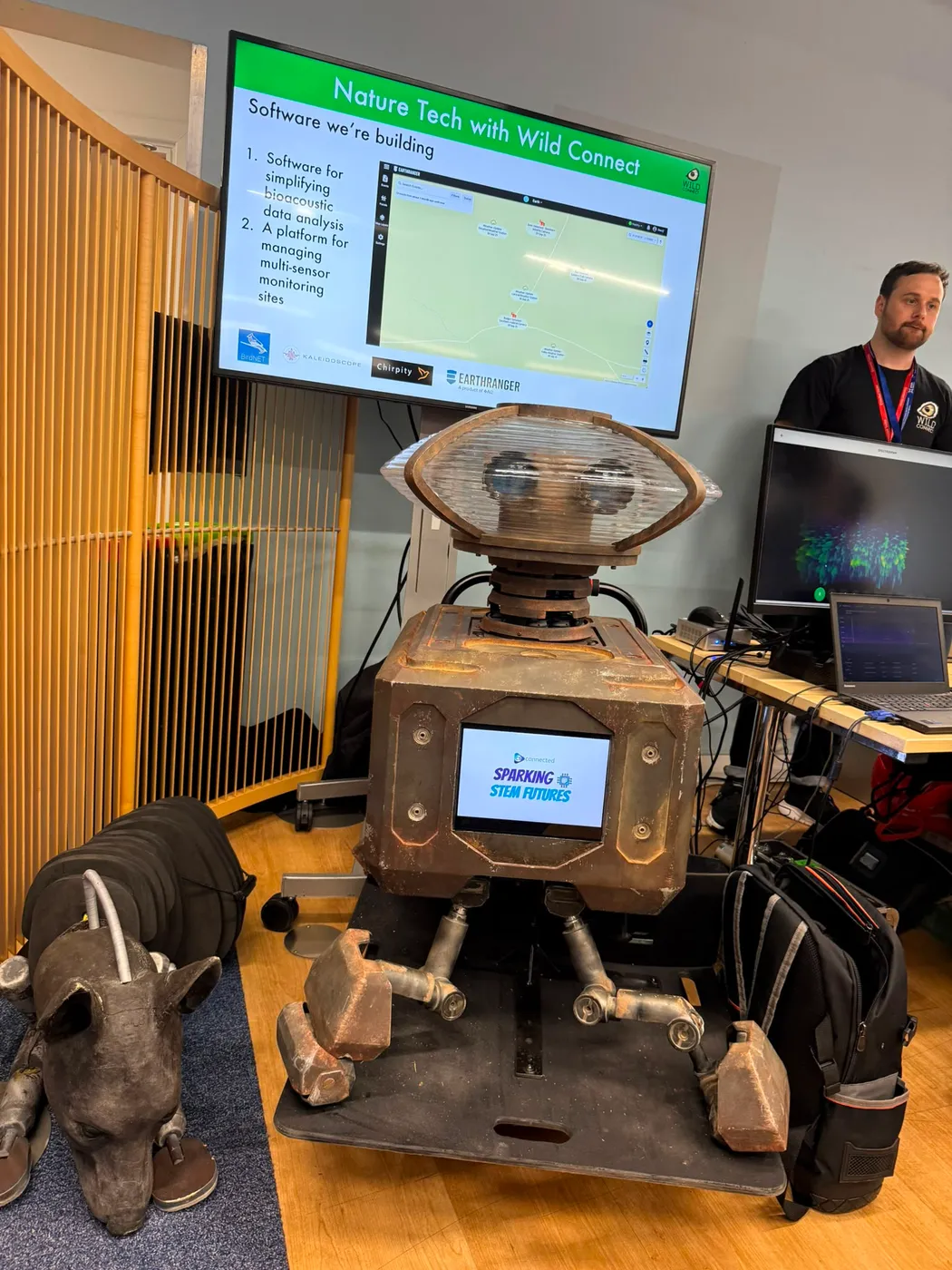 Die Bach assembled at a school, in front of a Wild Connect presentation about bioacoustic monitoring